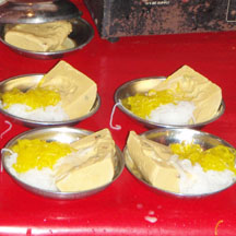 Kulfi from a street-side vendor, served with saffron tinted faluda noodles, sprinkled with rosewater.